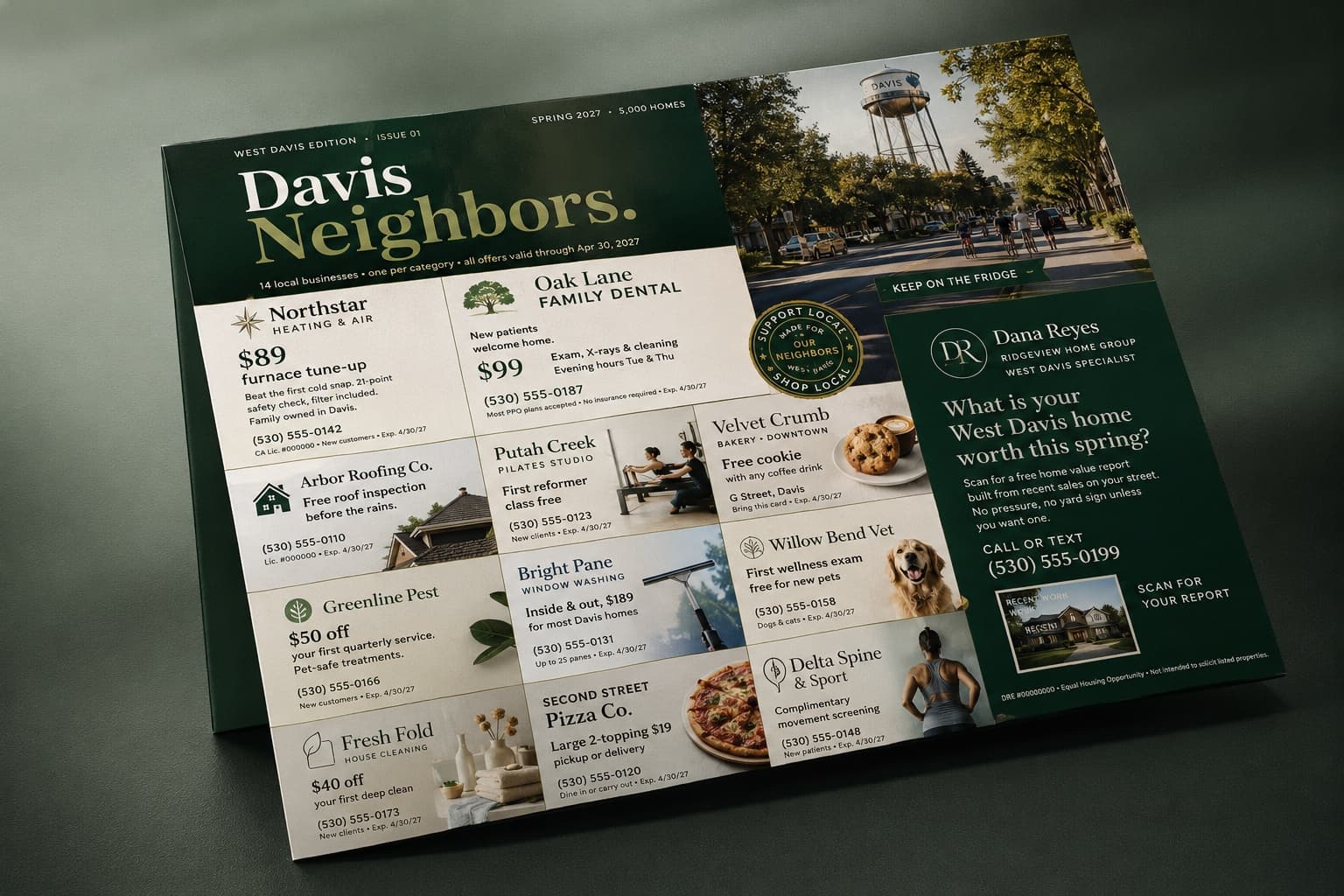 A mockup of the printed Davis Neighbors card: forest green, the Davis water tower, and a grid of local business ads